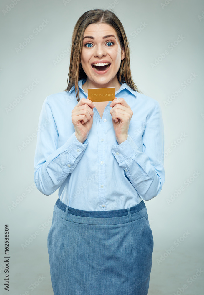 Happy bank emloyee woman holding golden credit card. Happy bank emloyee woman holding golden credit card.