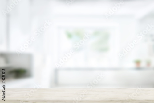 Empty marble table top in blurred modern kitchen room background. For product display montage.