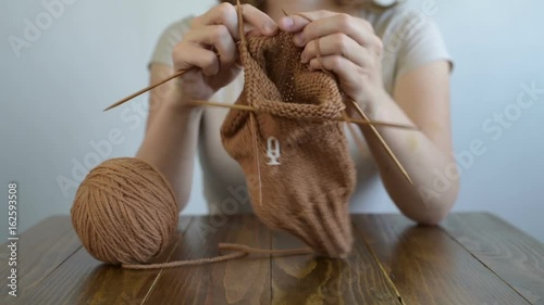Close up of a knitting woman