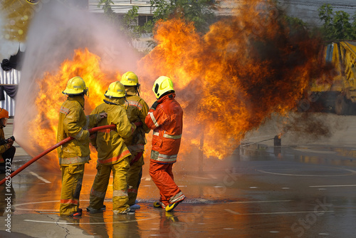 Fireman. Firefighters fighting fire during training.