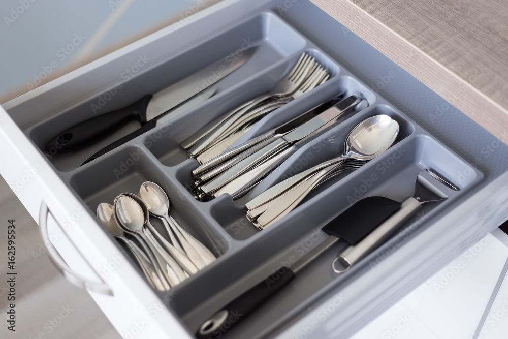 drawer with cutlery in modern kitchen drawer with cutlery in modern kitchen