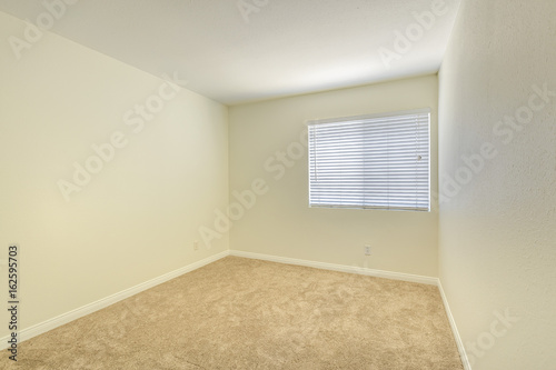 Empty bedroom in a model home in southern California © Jason