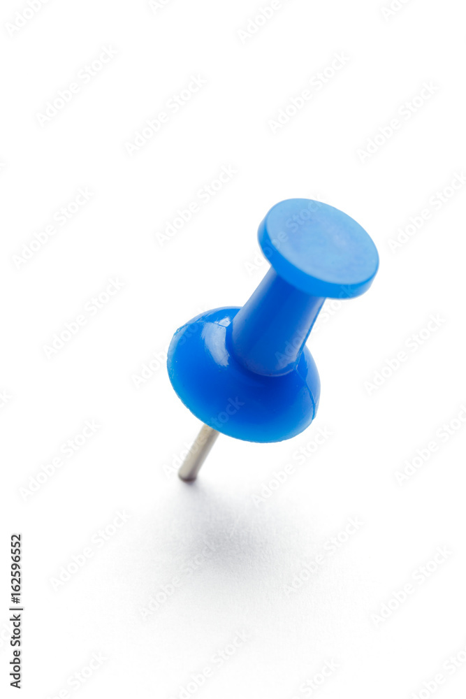 close up of a pushpin on white background close up of a pushpin on white background