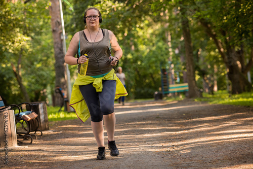 Overweight woman running. Weight loss concept.