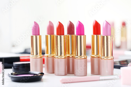 Colourful lipsticks on a white table