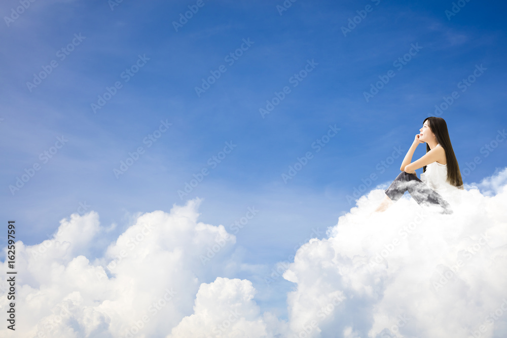 Naklejka premium young woman sitting on cloud and thinking&nbsp;concept