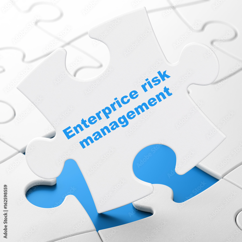 Business concept: Enterprice Risk Management on puzzle background