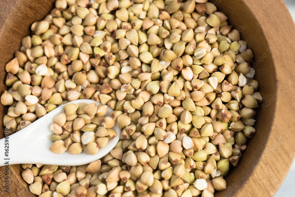 Fototapeta premium Buckwheat Groats Bulk Whole Grain Food White Spoon