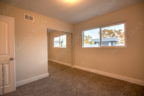 Empty bedroom in a model home in southern California