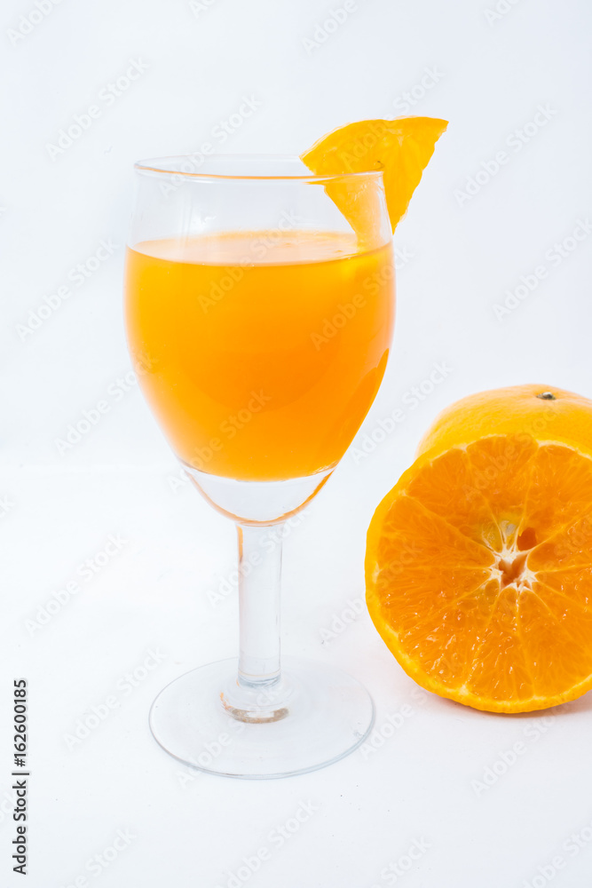 Orange juice and slices isolated on white