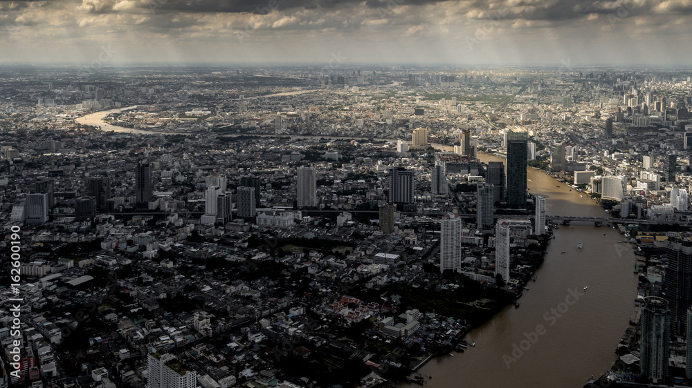 Beautiful Dramatic Aerial view of of the city and the river at sunset - Bangkok, Thailand
