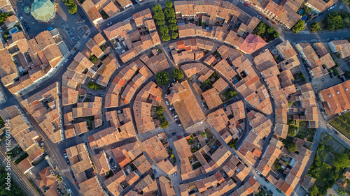 Aerial top view of Bram medieval village architecture and roofs from above, Southern France 