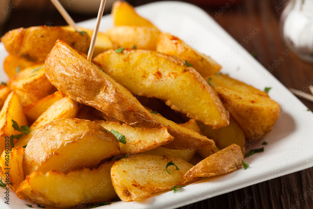 Traditional Spanish baked potato with hot pepper chili. Traditional Spanish baked potato with hot pepper chili.