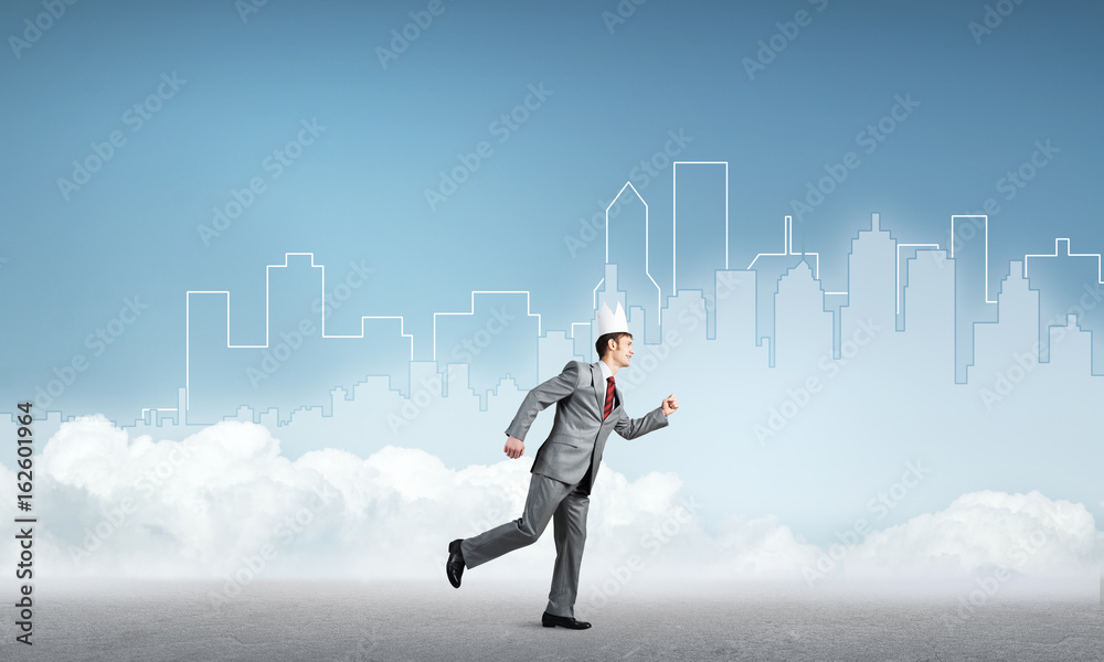King businessman in elegant suit running and blue cityscape silhouette at background King businessman in elegant suit running and blue cityscape silhouette at background