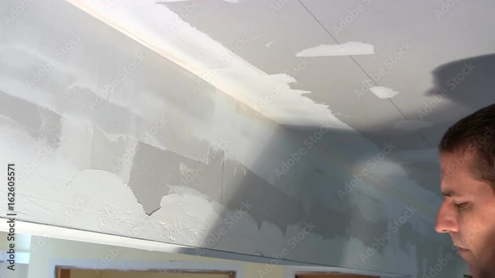 Homeowner puts joint compound over seam of drywall between wall and