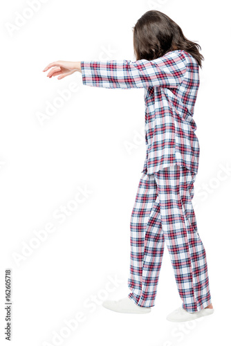 Canvas Print Woman suffers from sleepwalking in a dream, portrait in full length on a white b