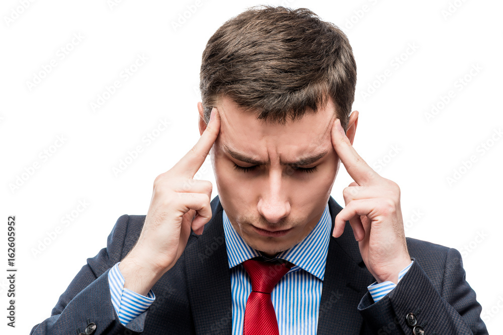 Portrait of a businessman with a strong headache and troubles in business on a white background Portrait of a businessman with a strong headache and troubles in business on a white background