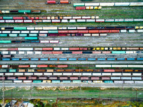 railway tracks and colorful wagons, top view, aerial shoot