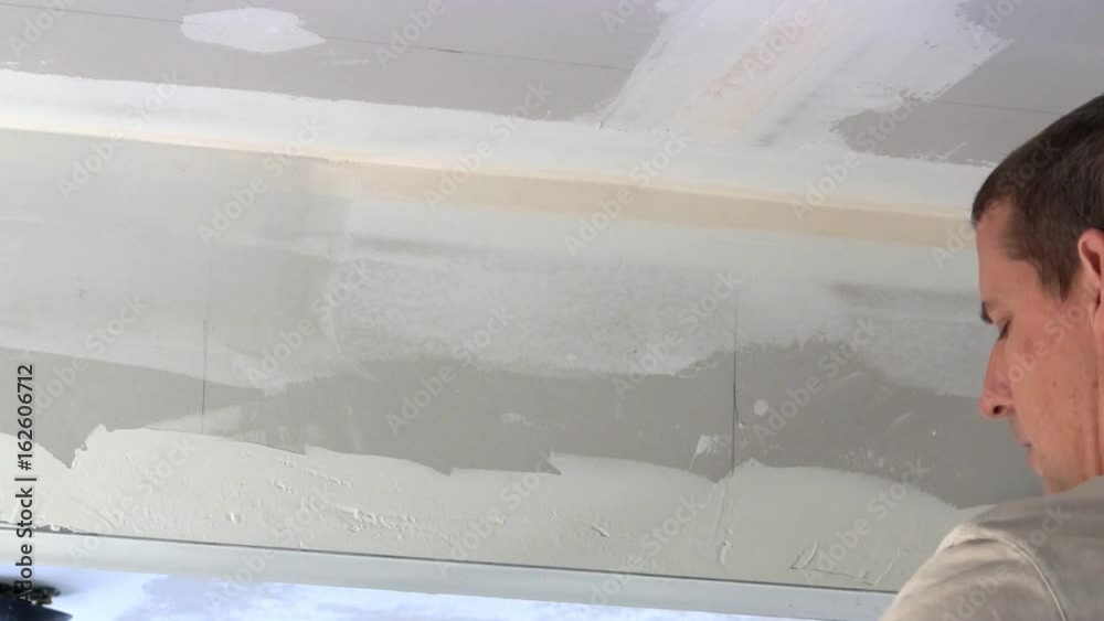 Homeowner puts joint compound over seam of drywall between wall and