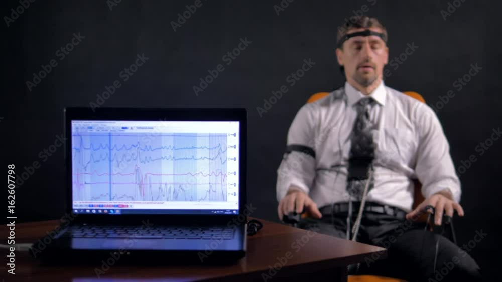 4K. Man connected to the lie detector circuit. 4K. Man connected to the lie detector circuit.