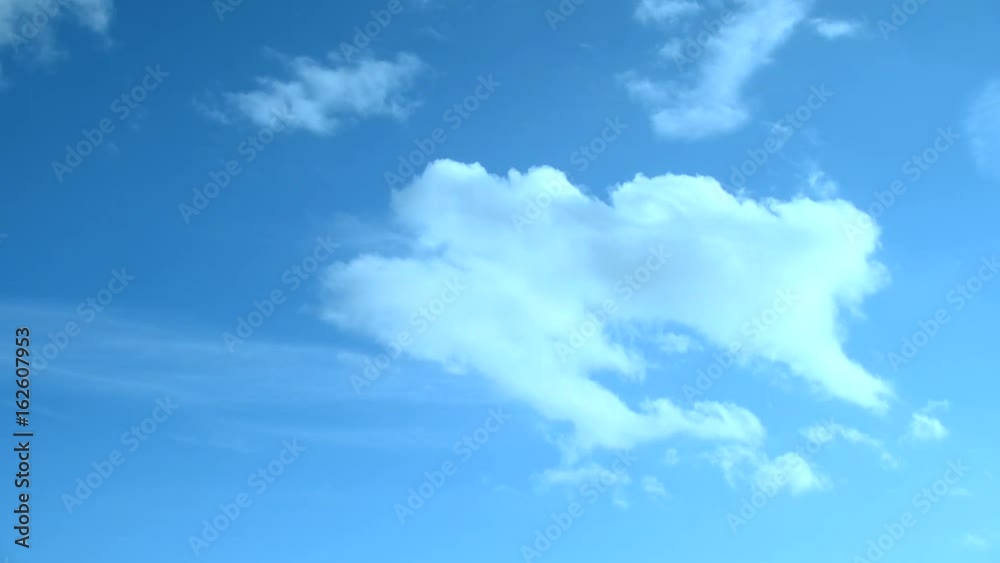 White fluffy clouds in the blue sky, time lapse. White fluffy clouds in the blue sky, time lapse.