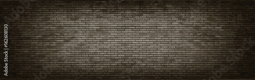 Black brick wall panoramic background.
