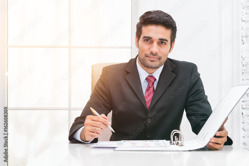 Young of businessman signing contract paper at desk Young of businessman signing contract paper at desk