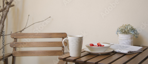 Breakfast table in wood and pastel tones