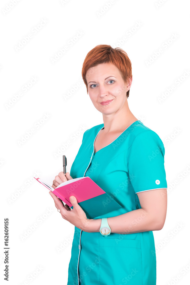 Pretty red-hair smiling woman nurse, cosmetologist, doctor, with notebook in her hands, isolated on white background, looking at the camera Pretty red-hair smiling woman nurse, cosmetologist, doctor, with notebook in her hands, isolated on white background, looking at the camera
