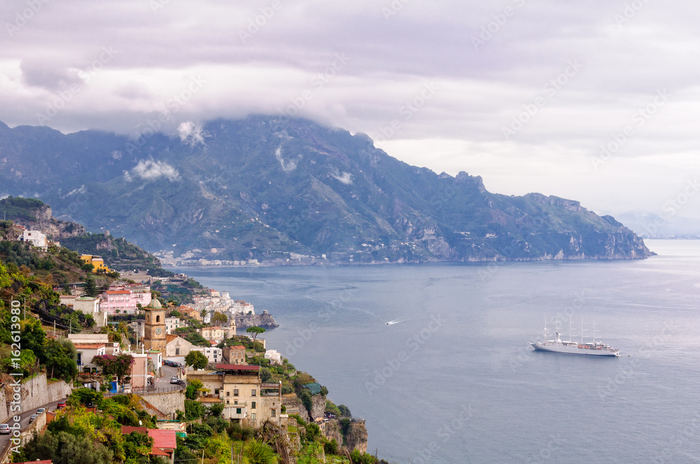 A cruise ship arrives in port before an autumn storm hits Amalfi - Campania, Italy