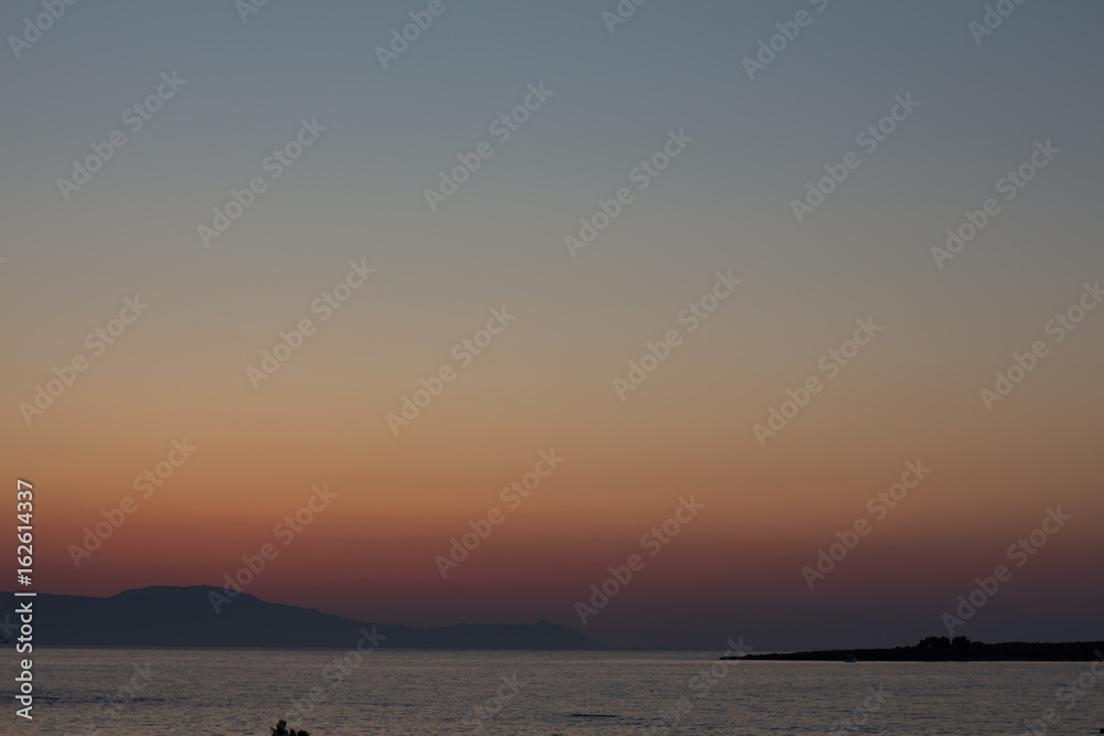 amazing golden sunset at the city of Chania in Crete, Greece. Aegean Sea