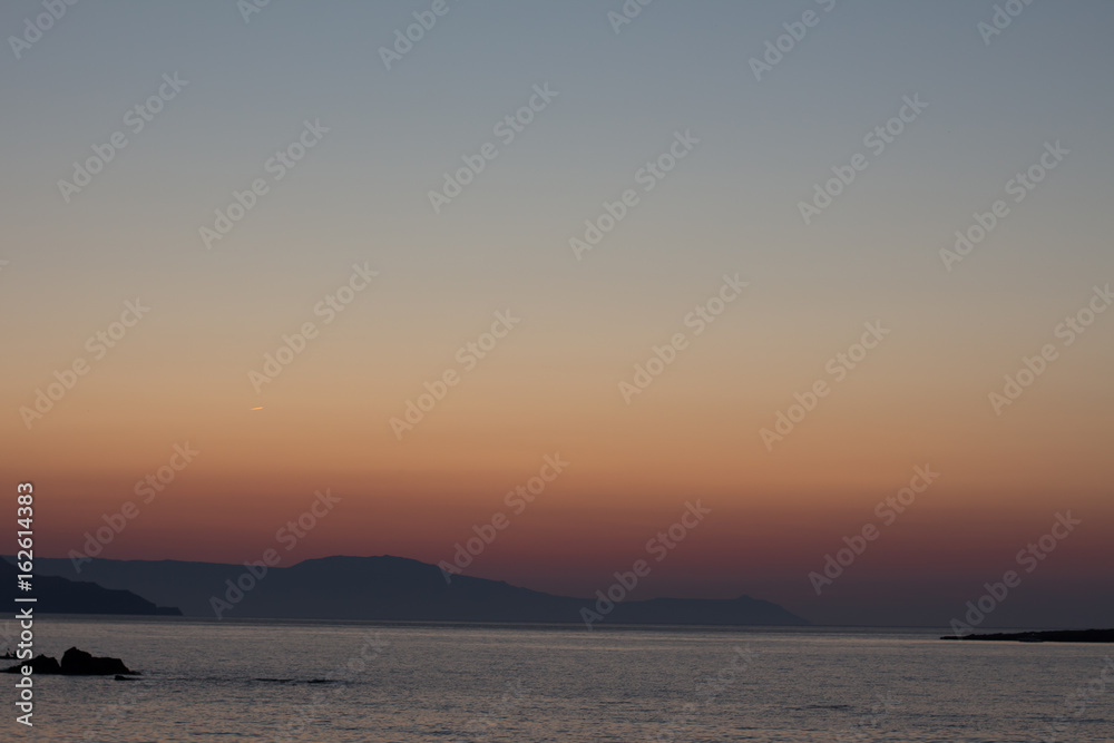 amazing golden sunset at the city of Chania in Crete, Greece. Aegean Sea