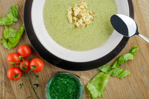 cream soup with cherry tomatoes photo