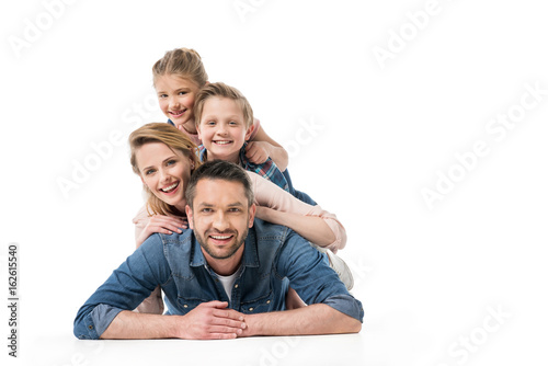 smiling family spending time together isolated on white