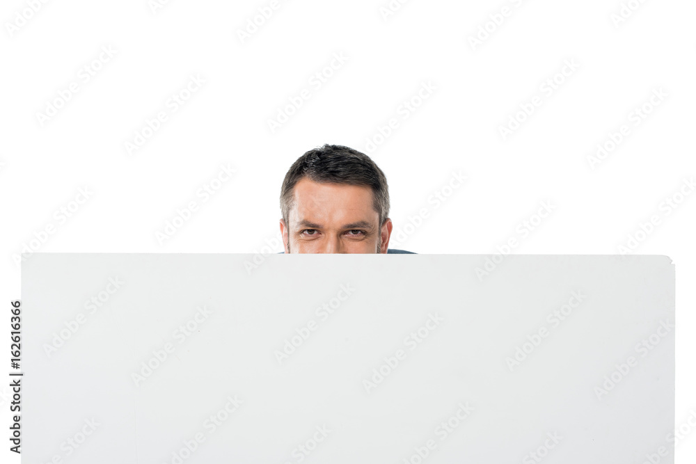obscured view of man hiding behind banner isolated on white obscured view of man hiding behind banner isolated on white
