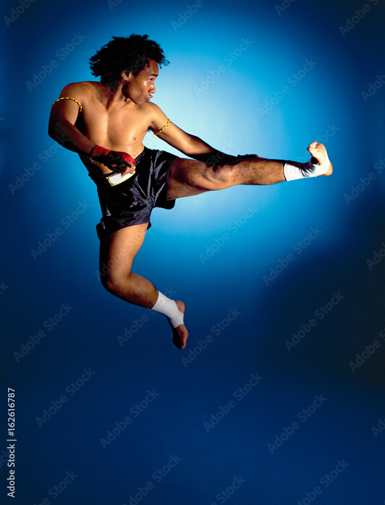 man doing jumping side kick