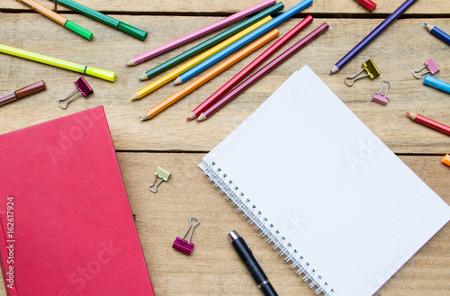 Top view of stationery on wooden table