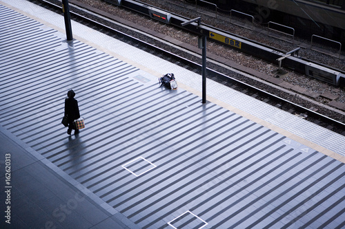 Photography Commuter standing on a platform