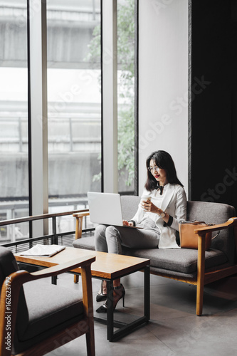 Business woman using laptop