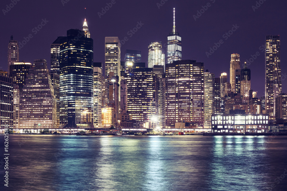 Εκτύπωση καμβά Manhattan skyline at night, color toning applied, New York City, USA