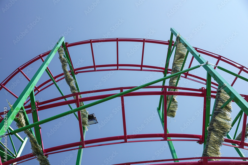 Rollercoaster track rail against a brilliant blue sky Rollercoaster track rail against a brilliant blue sky