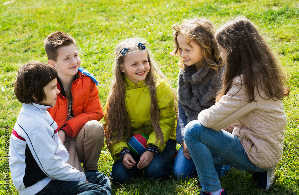Smiling kids chatting outdoor