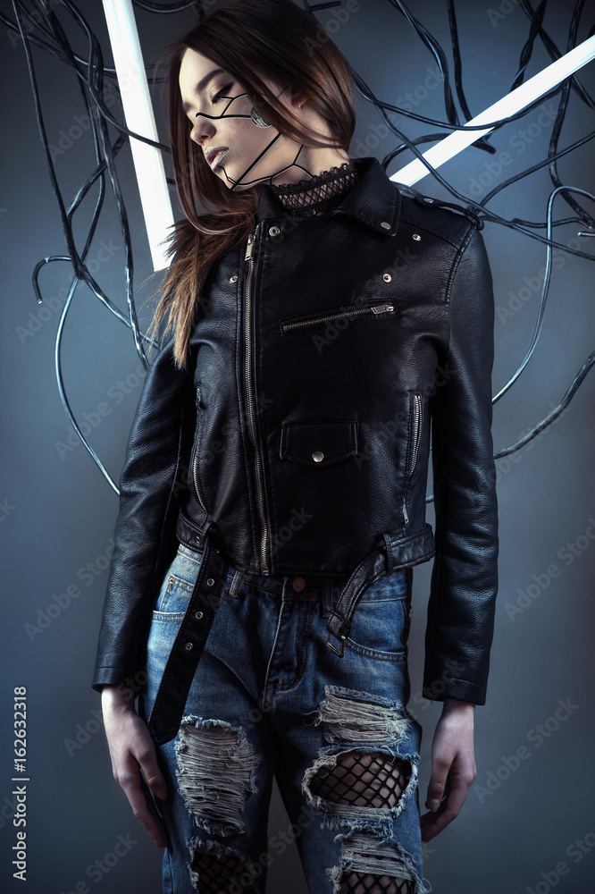 elegant robot girl in wires in style cyberpunk in leather jacket and ripped  jeans foto de Stock | Adobe Stock