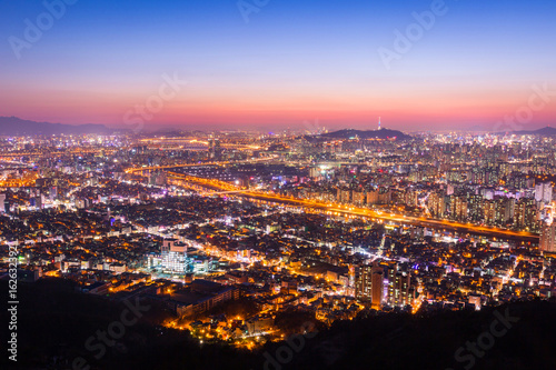 Downtown Seoul Beautiful night of Korea with Seoul Tower after sunset, South Korea. © panyaphotograph