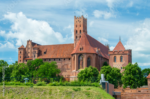 Castle fortifications of the Teutonic Order in Malbork from East. Malbork Castle is is the largest castle in the world measured by land area.