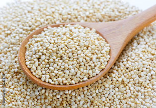 Quinoa in a wood spoon