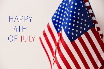 text happy 4th of july and american flags