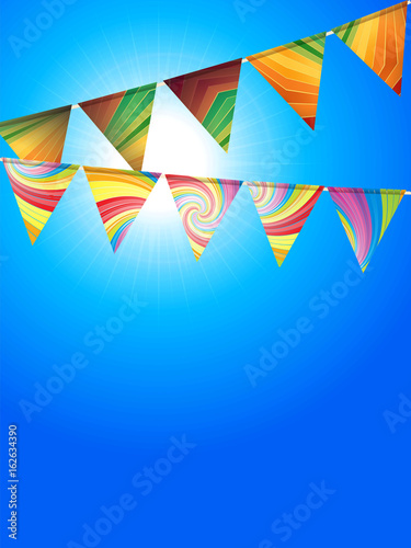 striped bunting over sunny blue sky