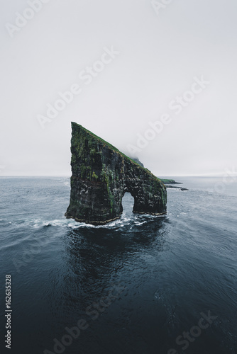 Arch standing in the ocean