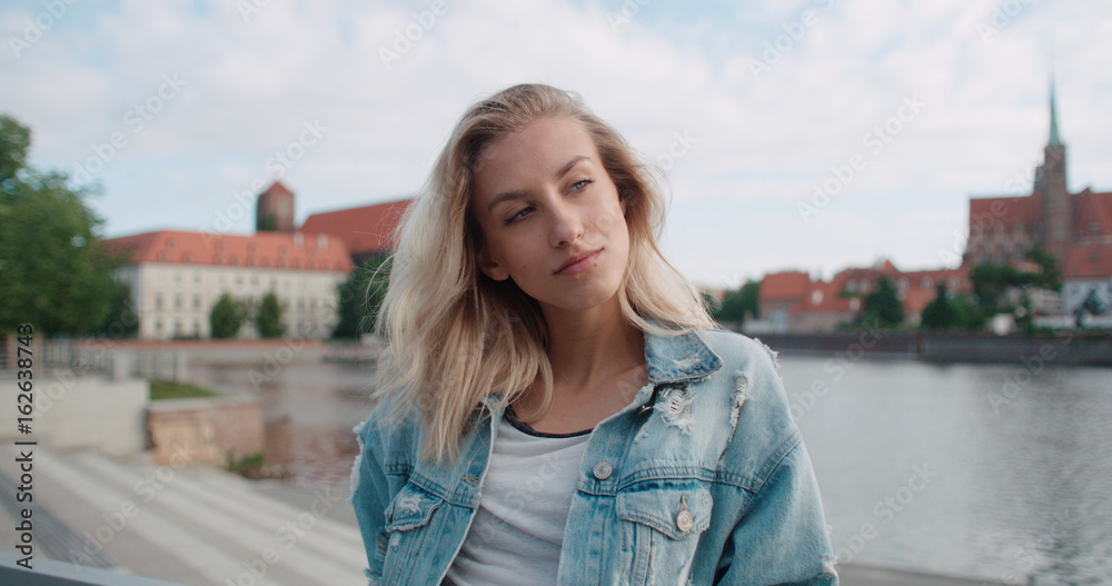 Portrait of beautiful fashion woman enjoying time in a city in Europe. 